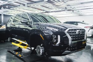 Black Hyundai ix35 SUV parked in a garage, showcasing its fuel efficiency.