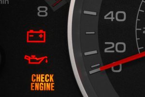 A dashboard with illuminating warning lights for battery, oil pressure, and check engine, indicating potential Hyundai iMax problems.