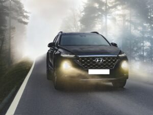 Hyundai SUV driving through fog, highlighting performance and engine components.